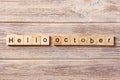 Hello October word written on wood block. Hello October text on table, concept Royalty Free Stock Photo