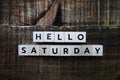 Hello Saturday alphabet letter on wooden background Royalty Free Stock Photo