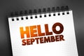 Hello September text on notepad, concept background