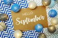 Hello September typography text on paper card with LED cotton balls decoration Royalty Free Stock Photo