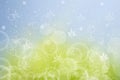 Hello spring background. Abstract bright spring or summer landscape texture with natural green yellow bokeh lights sun and flowers Royalty Free Stock Photo