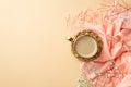 Hello spring concept. Top view photo of mug of frothy coffee on rattan serving mat pink scarf stylish glasses and gypsophila