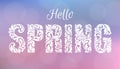 Hello, SPRING. Decorative Font made of swirls and floral elements. Delicate blurred background of pink and blue tones with bokeh. Royalty Free Stock Photo