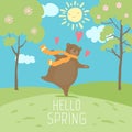 Hello Spring forest landscape. Cute bear love spring, sunny time, dance on green fresh grass.