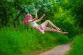 Hello Spring Gorgeous girl with raspberry hair among deer and flowers. Spring