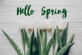 Hello spring text fresh sign.flat lay. stylish white tulips on r