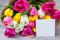 Hello spring time concept. Close-up photo of beautiful bouquet of multicolored pink yellow white flowers in paper wrapping with Royalty Free Stock Photo