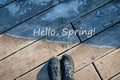 Hello Spring words. Concept of transition from winter to spring. Spring is coming. Warm and cold, frost and sun