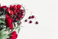 Hello summer. fresh cherries and strawberries in stylish glass b Royalty Free Stock Photo