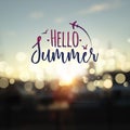 Hello Summer lettering typography on blurred sunset with bokeh lights