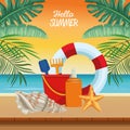 Hello summer seasonal scene with lifeguard float and sandbucket Royalty Free Stock Photo