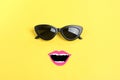 Hello summer The sun with stylish black sunglasses, smiling mouth on yellow background Royalty Free Stock Photo