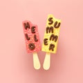 Hello Summer text and ice creams on pastel pink background