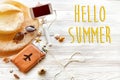 hello summer text , travel vacation concept, space for text. selfie stick phone camera passport money plane hat and sunglasses on Royalty Free Stock Photo