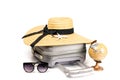 Hello summer. Womens accessories traveler: suitcase, straw hat, sunglasses and globe isolated on white background with empty space Royalty Free Stock Photo