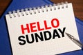 Hello Sunday word on notebook. Business conceptual