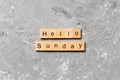 Hello sunday word written on wood block. hello sunday text on cement table for your desing, concept Royalty Free Stock Photo