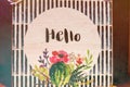 Hello text on a wooden plate.