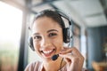 Hello and thank you for calling. Cropped portrait of an attractive young woman working in a call center. Royalty Free Stock Photo