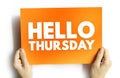 HELLO THURSDAY text on card held by hands. Positive weekday greeting, motivational note concept, cheerful typography design, daily Royalty Free Stock Photo