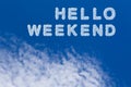 Hello weekend typography note on cloudy sky. Beautiful blue sky and cloud with Hello weekend word