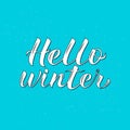 Hello Winter calligraphy lettering on blue background. Quote hand drawn with brush. Typography poster. Vector illustration. Easy Royalty Free Stock Photo