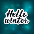 Hello Winter hand drawn on bright blue background with bokeh. Calligraphy brush lettering. Holidays mood vector illustration. Easy Royalty Free Stock Photo
