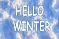 Hello Winter lettering inscription, winter human footprints in the snow winter background texture Royalty Free Stock Photo