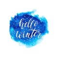 Hello winter text on blue watercolor splash Royalty Free Stock Photo