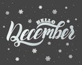 Hello winter text. Brush lettering at blue winter background with snowflakes and bokeh lights Royalty Free Stock Photo