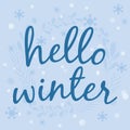 Hello winter text. Brush lettering at blue winter background with snowflakes Vector card design with custom calligraphy