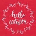 Hello winter text on red knit texture background. Winter season cards, december typography greetings for social media Royalty Free Stock Photo