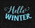 Hello winter text. Vintage chalk lettering on blackboard with swirls and decorations.