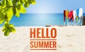 Hellow summer banner on sandy beach with colorful oras and green leaf on beach background Royalty Free Stock Photo