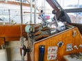 Helm of old retro wooden boat a boat dock with instruments pulled out for repair Royalty Free Stock Photo