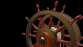 Helm wheel of an old sailing ship isolated on dark background Royalty Free Stock Photo