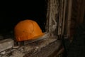 A fireman helmet on a windowsill after the fire