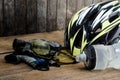 Helmet, gloves and water bottle - bicycle accessories on Wood. Royalty Free Stock Photo