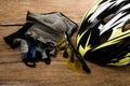 Helmet, gloves and water bottle - bicycle accessories on Wood. Royalty Free Stock Photo