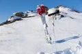 Helmet and Goggles with Skis and Poles on Hillside