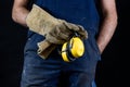 Helmet held by a construction worker. Protective clothing for ma Royalty Free Stock Photo