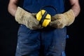 Helmet held by a construction worker. Protective clothing for ma Royalty Free Stock Photo