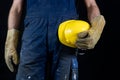 Helmet held by a construction worker. Protective clothing for ma Royalty Free Stock Photo