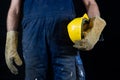 Helmet held by a construction worker. Protective clothing for ma Royalty Free Stock Photo