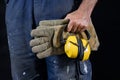 Helmet held by a construction worker. Protective clothing for ma Royalty Free Stock Photo