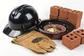 Helmet, roulette, bricks, and gloves isolated Royalty Free Stock Photo