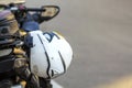 Helmet on sports motorcycle on road. Motorbike parked on a street. Freedom and travel concept. Royalty Free Stock Photo