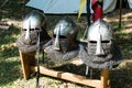 Helmets of armors and medieval military clothing in a historical Royalty Free Stock Photo
