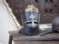 Helmets medieval of knights on a table Royalty Free Stock Photo