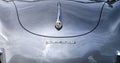 Porsche 356 sports car in the front view with curved rounded bodywork and the emblem of the